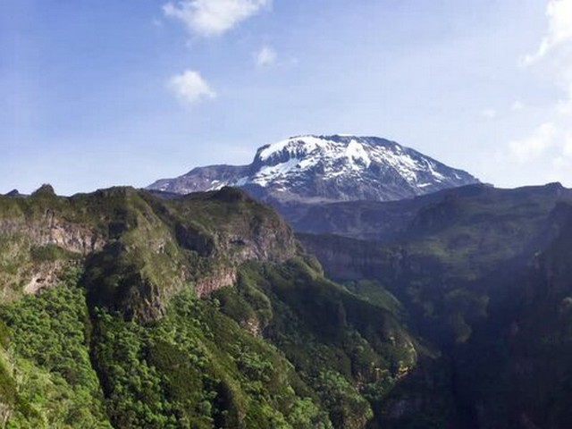 How many people climb Kilimanjaro each year?