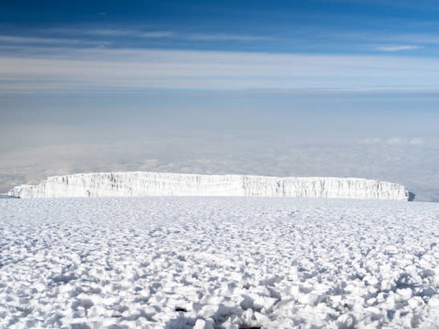 How are the guides and porters selected for Kilimanjaro treks?
